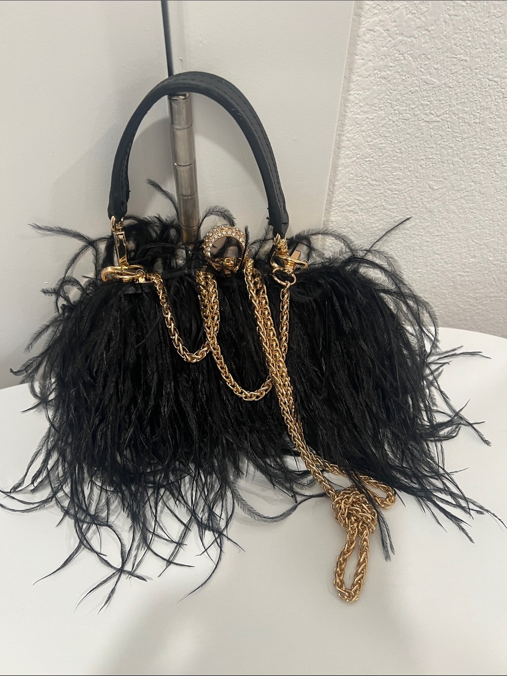 Chic Black Ostrich Feather Mini Bag with Gold Chain Accent with ring closure